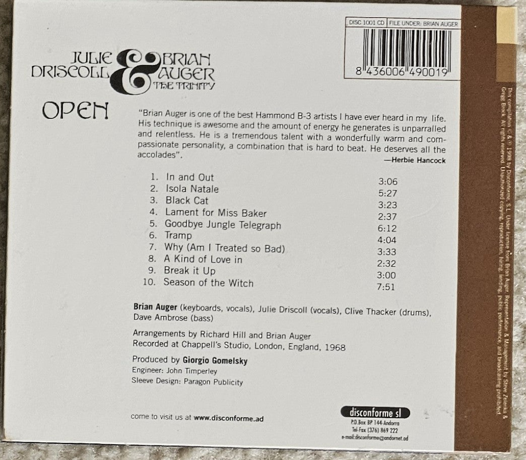The back cover of a music CD for Julie Driscoll & Brian Auger's album 'Open', showing tracklist, credits, barcode, and website information on a brown background.