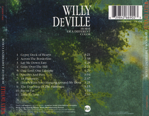 The back cover of the Willy Deville 'Horse of a Different Color' CD album, featuring a dark green and black textured background with white text and a barcode.