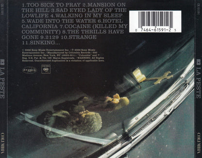 Back cover of the CD release of La Peþte's 'Cool and Kind' album, featuring a dark sci-fi illustration of a spaceship interior with a figure floating in space, a barcode, and tracklist text.