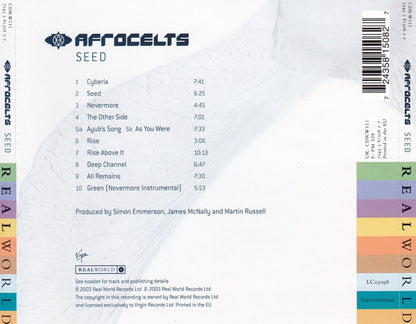 The back cover of the Afrocelts 'Seed' vinyl record, showing the track list, production credits, barcode, and side labels on a white background with a faint abstract pattern.