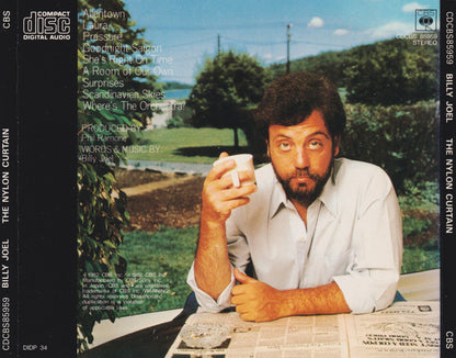 Billy Joel's 'The Nylon Curtain' compact disc album cover artwork, showing a man holding a mug outdoors with a green lawn and blue sky in the background. The left side displays track listings and the right side displays the artist and title.