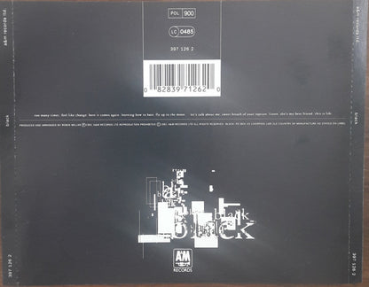 The back cover of a Black Album vinyl record, featuring a dark charcoal background with white text, a barcode, and the AM Records logo at the bottom.