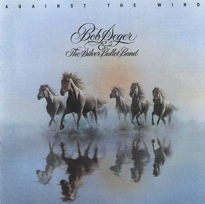 Album cover for Bob Seger's 'The Silver Bullet Band' titled 'Against the Wind', featuring five horses running across a misty reflective landscape with their reflections visible.