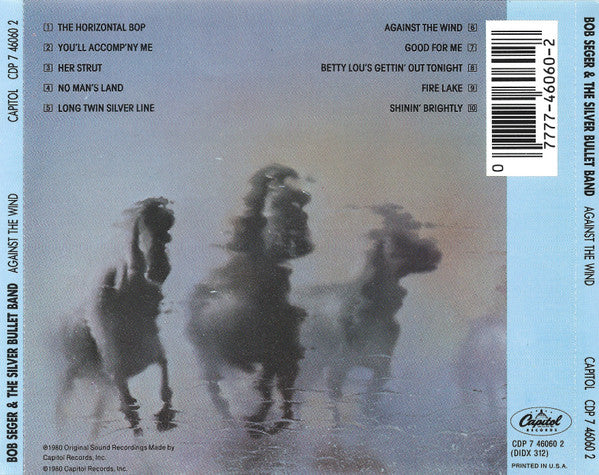Back cover of a CD release for Bob Seger and the Silver Bullet Band's album 'Against the Wind', featuring a misty, low-contrast photograph of three horses in the center, tracklist on the left, barcode on the right, and Capitol Records branding at the bottom.
