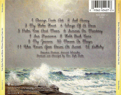 Rear cover of Van Dyke Parks and Brian Wilson's 'Orange Crate Art' CD package, featuring a textured beige and gray background with a list of 12 track titles in gray script, a barcode in the top right, and a wave scene at the bottom.