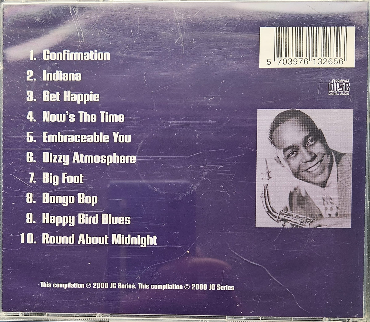 Back cover of a 2000 JG Series CD compilation featuring a tracklist on a purple background and a black-and-white portrait photo of Louis Armstrong.