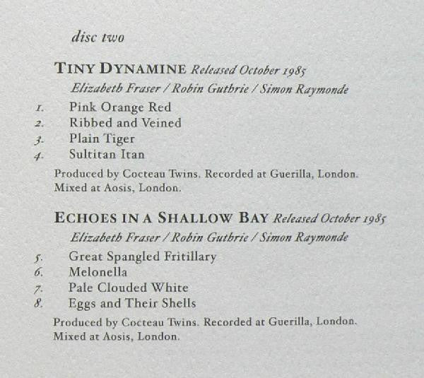 A close-up of a printed tracklist page for Tiny Dynamite's 'Released October 1985' and 'Echoes in a Shallow Bay' with artist names Elizabeth Fraser, Robin Guthrie, and Simon Raymonde.