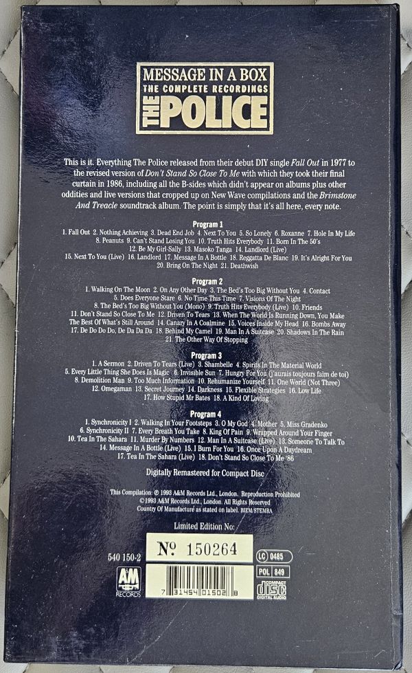 Back cover of CD case for The Police's 'Message in a Box: The Complete Recordings', showing track listings and barcode on a dark background.