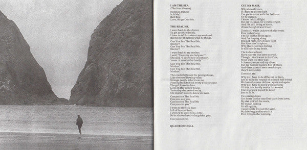 An open book spread showing a black-and-white photograph of a person walking between large rocky cliffs on the left page and printed song lyrics on the right page.