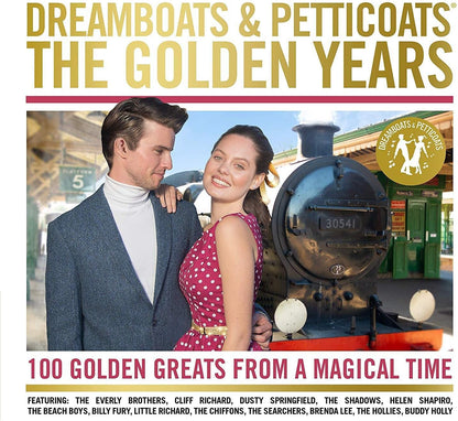 Album cover for 'Dreamboats & Petticoats: The Golden Years' featuring a vintage photograph of a man and woman standing in front of a steam locomotive. Large gold title text appears at the top, with red and black subtitle text at the bottom and a gold circular '100 Greats from a Magical Time' badge on the right.