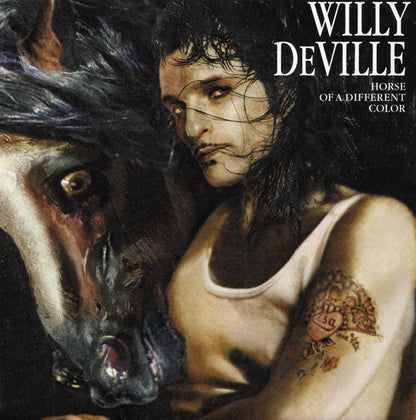 Album cover art for Willy Deville's 'Horse of a Different Color', featuring a painted portrait of a woman in a white tank top next to a horse, with the artist's name and album title in white text at the top right.