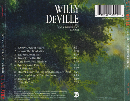 The back cover of the Willy Deville 'Horse of a Different Color' CD album, featuring a dark green and black textured background with white text and a barcode.
