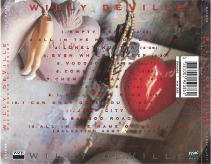 The back cover of the CD album 'Willy Deville: Works of Desire' featuring a collage of vintage photographs of a woman in a white dress, red tracklist text, and a barcode on a gray background.