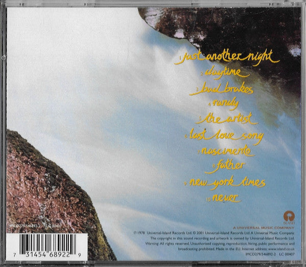 The back cover of a music CD, featuring a scenic photograph of a snowy mountain landscape under a cloudy sky. The tracklist is written in yellow handwritten font, and a barcode is visible in the bottom left corner.
