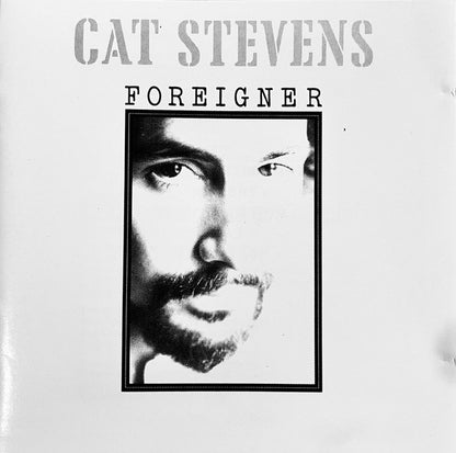 Cat Stevens 'Foreigner' album cover featuring a black and white close-up portrait of the artist's face, with the text 'CAT STEVENS' and 'FOREIGNER' on a white background.