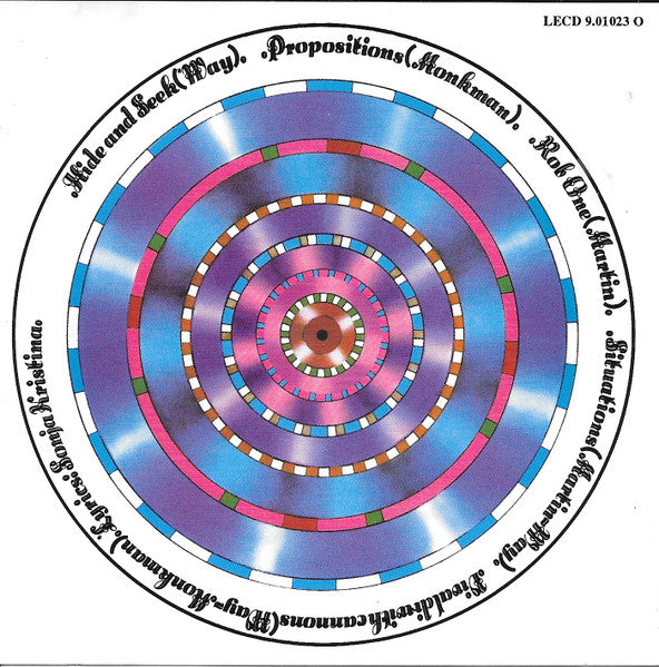 curved air air conditioning cd back cover. A circular printed design with concentric rings in blue, pink, purple, white, and green, surrounded by black text on a white background. Small text in the top right reads 'LECD 9.